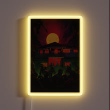 Charger l'image dans la galerie, Undead residents gather before a house with glowing electric welcome.