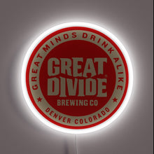 Charger l'image dans la galerie, Bold and iconic, this neon sign features the Great Divide Brewing Co. logo with the motto "Great Minds Drink Alike," celebrating Denver’s craft beer legacy with luminous pride.