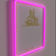 Charger l'image dans la galerie, Colorful Mann's Brown Ale logo illuminated in vibrant RGB neon.