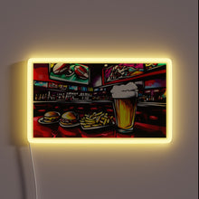 Charger l'image dans la galerie, Neon sports bar decor with vibrant beer signs and food.