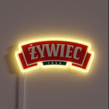 Charger l'image dans la galerie, Vibrant LED sign featuring Zywiec Beer's logo in neon colors