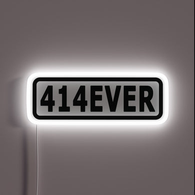 Vibrant 414EVER RGB neon sign for a modern gaming setup.
