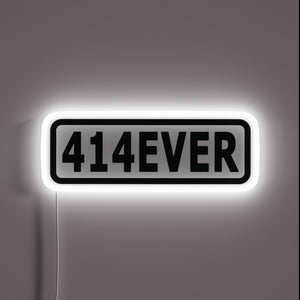 Vibrant 414EVER RGB neon sign for a modern gaming setup.