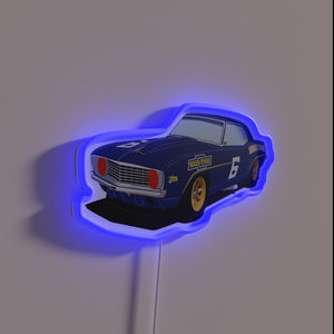 Electric nostalgia: Neon '69 Z28 Trans Am muscle car emblem.