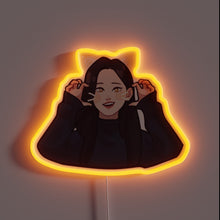 Charger l&#39;image dans la galerie, Alt text: &quot;Neon sign of a smiling anime-style girl with cat ears and whiskers, glowing in orange light.&quot;
