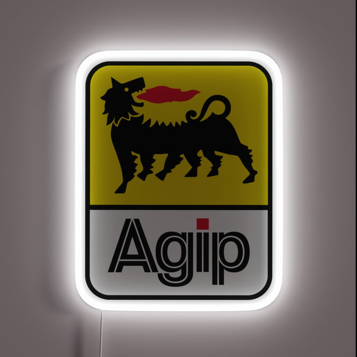 UV printed RGB LED neon sign of the vintage Agip logo featuring a six-legged black dog breathing red fire on a yellow and white background, framed by a glowing white rectangular LED border.