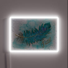 Charger l&#39;image dans la galerie, Vibrant neon symbol of faith with textured, ink-stamped feather design.