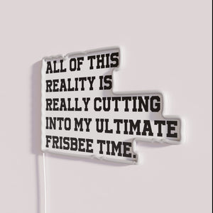 Neon Sign: Humorous Reminder to Prioritize Ultimate Frisbee Over Daily Routine