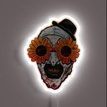 Charger l&#39;image dans la galerie, Terrifier 2 neon sign – Art the Clown in bloody detail with creepy sunflower sunglasses and top hat. A chilling horror piece for fans of the cult slasher film.