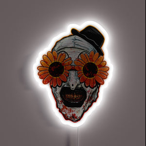 Terrifier 2 neon sign – Art the Clown in bloody detail with creepy sunflower sunglasses and top hat. A chilling horror piece for fans of the cult slasher film.