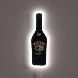 Neon sign of a Baileys Irish Cream bottle with a white glowing outline.
