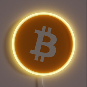 Minimalist Bitcoin neon sign with glowing orange circle.