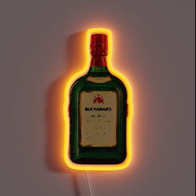 Charger l&#39;image dans la galerie, Alt text: *Neon sign shaped like a green Buchanan’s whiskey bottle with glowing orange outline on a dark wall.*