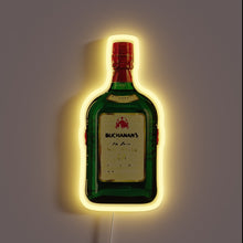 Charger l&#39;image dans la galerie, Neon sign shaped like a Buchanan&#39;s bottle with a yellow glow.
