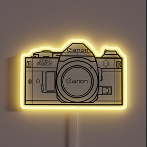 Vintage Analog Photography Meets Modern Neon in Retro Canon Sign.