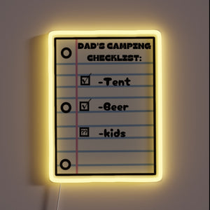 Colorful neon sign reading 'Dad's Camping Checklist' in bold letters