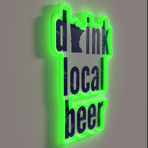 Support local breweries with vibrant neon glow of 'Drink Local' sign.