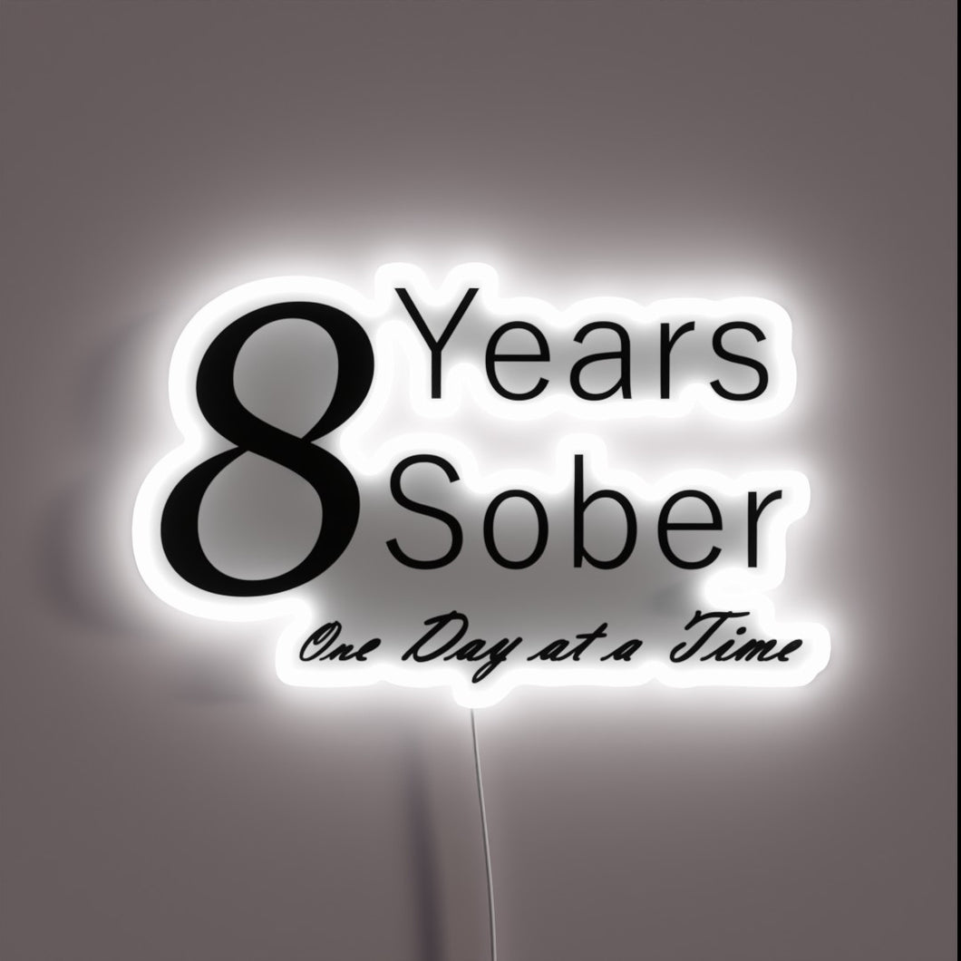 Neon anniversary sign celebrating one year of sobriety milestones daily.