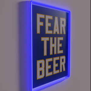Bright blue beer-themed neon sign with 'Fear The Beer' lettering