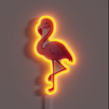 Charger l&#39;image dans la galerie, Alt text: &quot;Neon sign of a pink flamingo standing on one leg, outlined with a glowing orange-red light.&quot;

