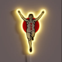 Charger l&#39;image dans la galerie, Neon sign of Glico Running Man with arms raised, glowing in yellow.