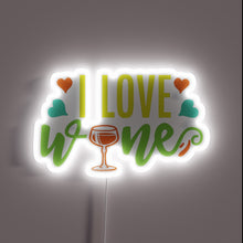 Charger l&#39;image dans la galerie, I Love Wine&quot; in bold, colorful, glowing RGB neon letters.