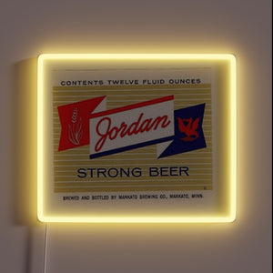 Neon sports-themed beer sign featuring Jordan Strong logo in RGB.