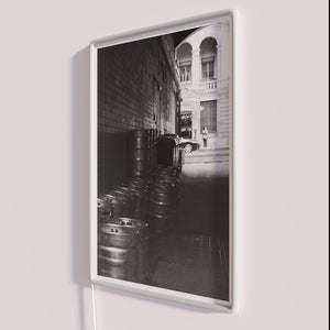 Vintage bar decor lighting with colorful Keg Alley sign ambiance.