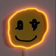 Charger l&#39;image dans la galerie, Wavy yellow neon smiley face with abstract black eyes.
