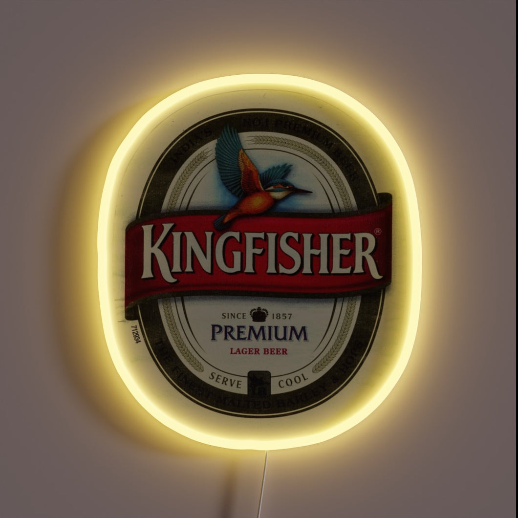 Eye-catching neon sign featuring vibrant Kingfisher beer branding colors glowing