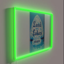 Charger l&#39;image dans la galerie, Vibrant LED sign proudly displays brand logo in modern style.