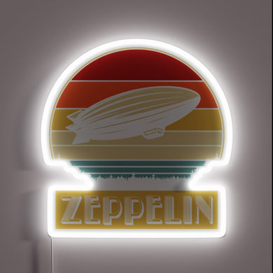 Retro Zeppelin neon sign with white glow and sunset color stripes.