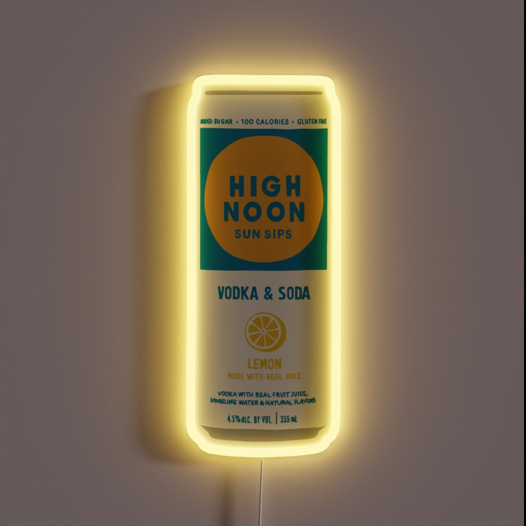 Brightly lit customneon sign shaped like a High Noon Sun Sips vodka soda can in lemon flavor, glowing with a soft yellow border around the can’s vibrant turquoise and yellow label.