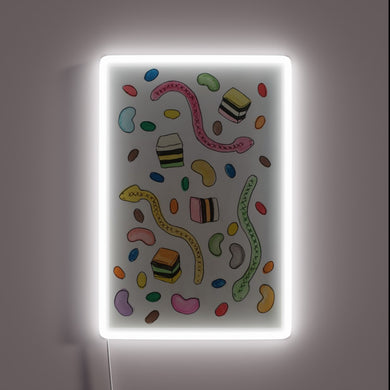 Neon-lit LED lollipop decorations in vibrant RGB colors lighting up.