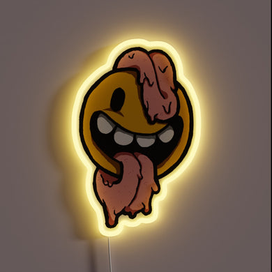 Melting smiley face neon sign with exaggerated long tongue and yellow glow.