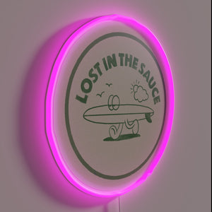 Vibrant neon sign featuring stylized typography with sauce theme