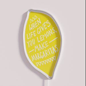Add vibrant nightlife charm with colorful Make Margaritas neon sign