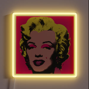 Pop art-style customneon sign of Marilyn Monroe with vibrant yellow hair, pink eye shadow, and red background, framed by a glowing yellow neon square