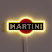 Charger l&#39;image dans la galerie, Neon sign of the MARTINI logo with bold white text on a black rectangle over a red circle, glowing with a yellow outline.
