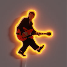 Charger l&#39;image dans la galerie, Neon sign of a faceless guitarist in a suit, inspired by Marty McFly&#39;s iconic performance with a glowing orange outline.