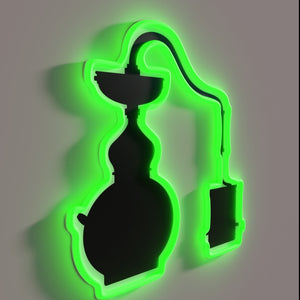 Moody, vintage-style moonshine still illuminated with colorful RBG neon lights.