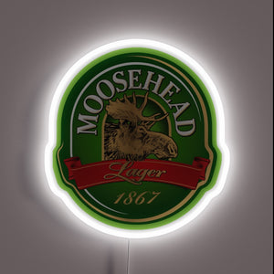 **Alt Text:** Moosehead Lager neon sign with moose logo and white glow.