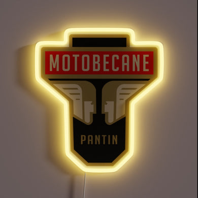 Vintage Motobécane headstock logo with glowing yellow neon outline.