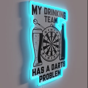 My drinking team has a darts problem" colorful neon sign.