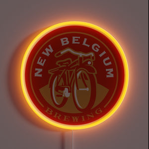 This glowing neon sign features the iconic New Belgium Brewing logo — a red cruiser bicycle set against a warm amber hue — making it a perfect tribute for craft beer lovers and brewery aficionados alike.