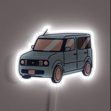 Charger l&#39;image dans la galerie, Vibrant neon sign illuminating the unique Nissan Cube interior style.