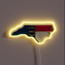 Charger l&#39;image dans la galerie, Neon sign shaped like North Carolina with the state flag and yellow glow.
