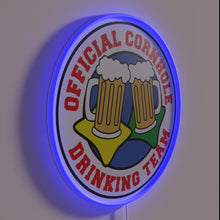 Charger l&#39;image dans la galerie, Vibrant RGB neon sign: Official Cornhole Drinking Team branding statement.