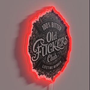Neon 'Old Fuckers' club logo sign in bold RGB lighting.