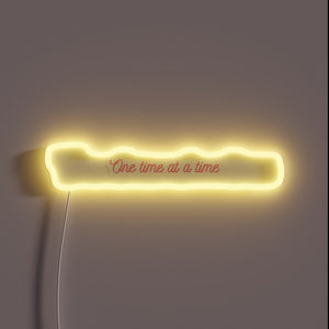 Live in the moment with vibrant "One Day At A Time" sign.